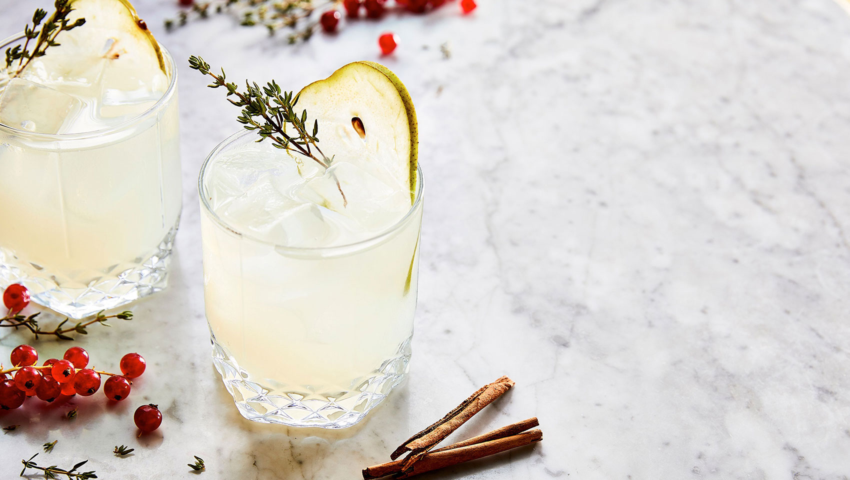 Holiday Cocktails with cranberries and cinnamon sticks