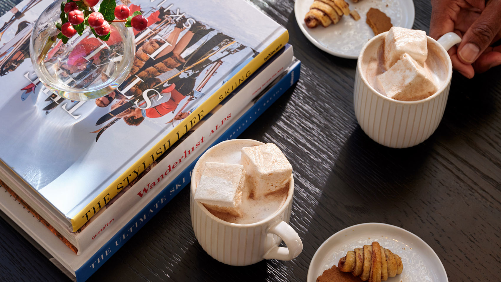 Hot Chocolate next to a stack of books